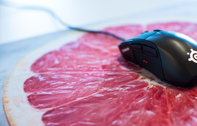 Mouse on top of grapefruit mousepad