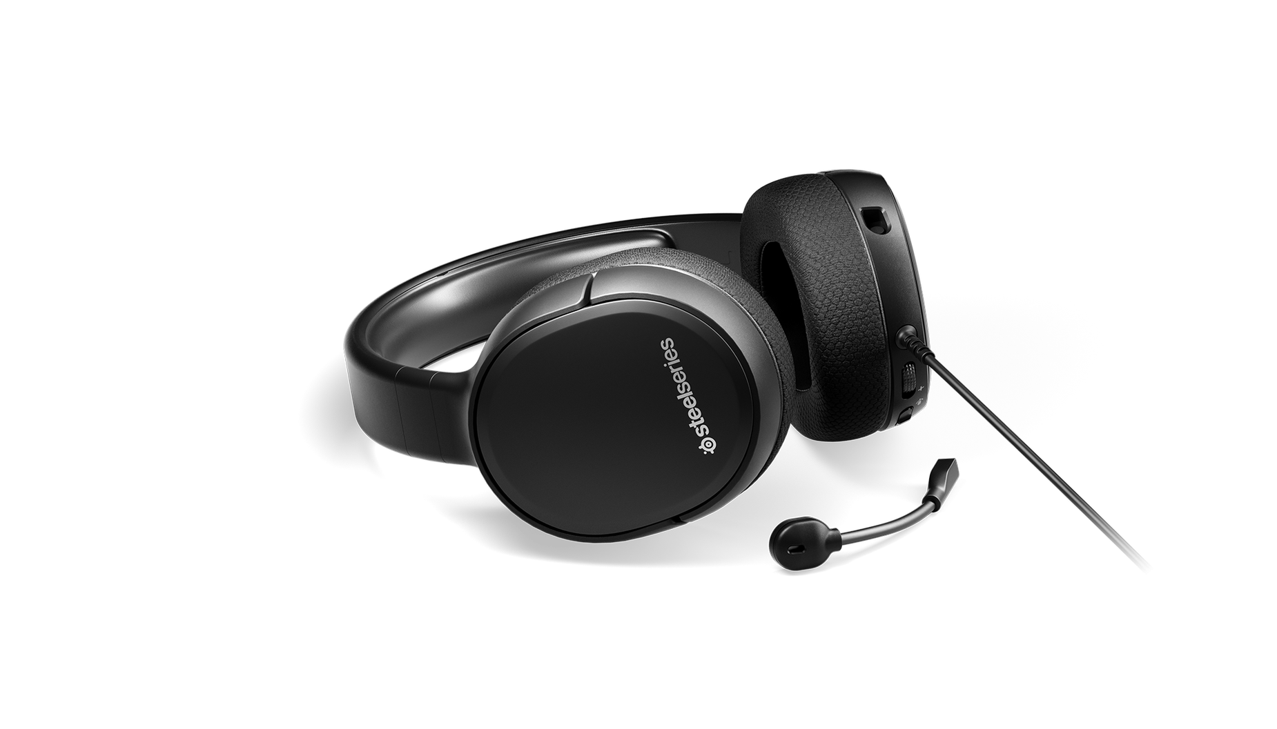  Arctis 1 gaming headset on surface with microphone detached. 