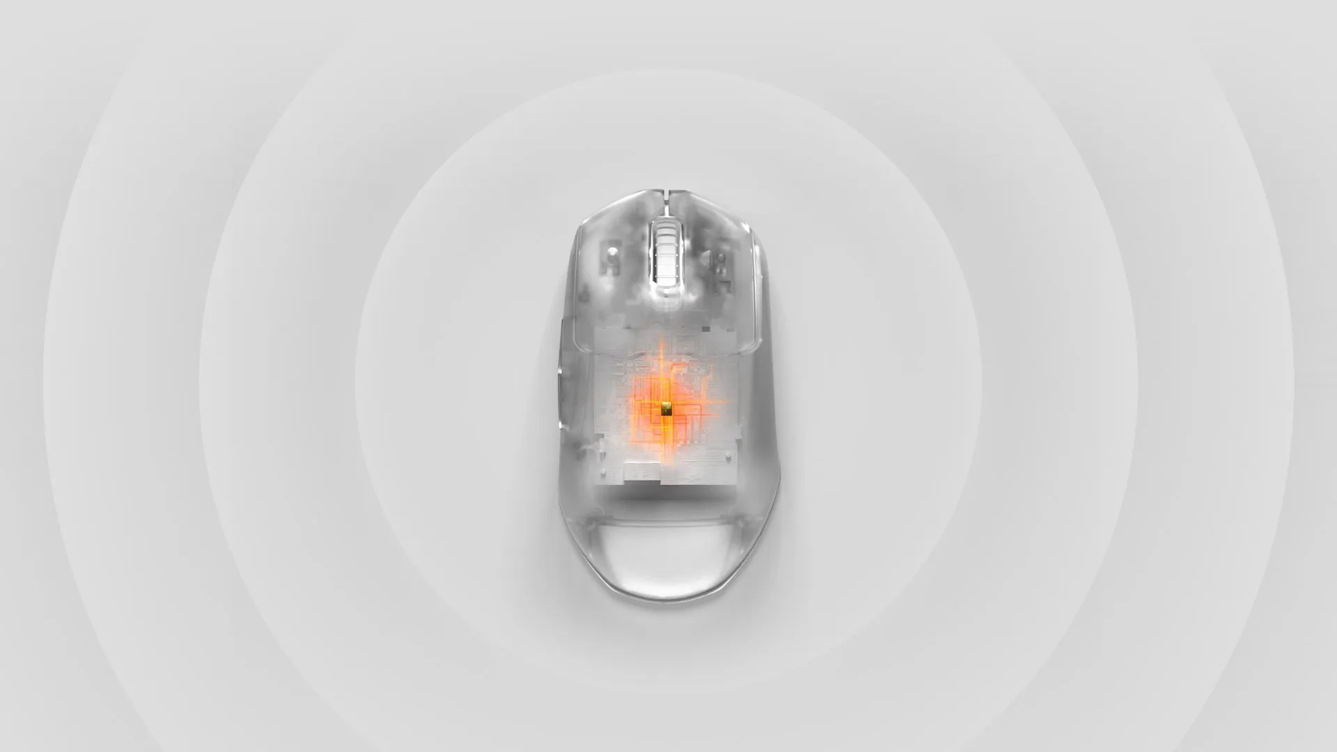 A transparent mouse with the sensor seen through the top down and ripples coming from the center.