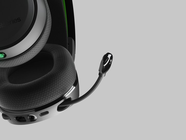 Closeup view of the Arctis 7x+ wireless gaming headset with the mic extended.