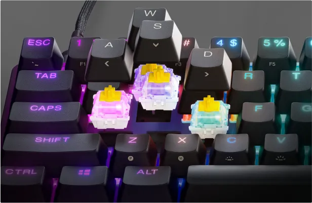 Keycaps lifted off to show the optipoint switches on an Apex 9 keyboard.
