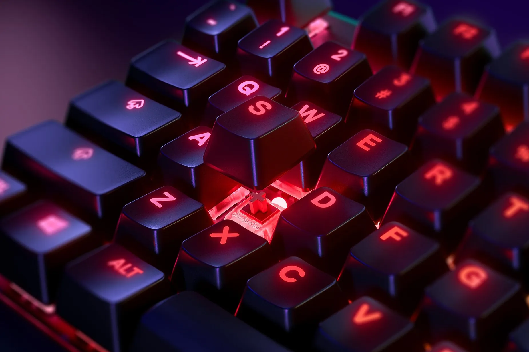 
 Zoomed in view of a single key on the German - Apex 7 TKL (Red Switch) gaming keyboard, the key is raised up to show the SteelSeries QX2 Mechanical RGB Switch underneath
 